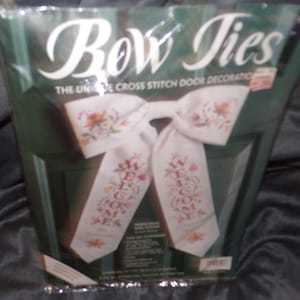 May include: A handmade wooden sign with the text "Welcome to our home" in a handwritten style. The sign is painted white with black lettering and a distressed finish, suitable for indoor or outdoor use.