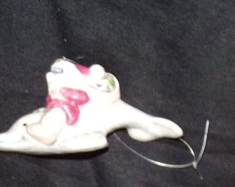 Adorno de cerámica de Papá Noel montando un delfín