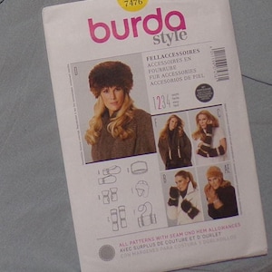 May include: A Burda Style sewing pattern packet showing various fur accessories. The packet features images of a fur hat, scarves, gloves, and a jacket. Text on the packet includes "FELLACCESSOIRES", "FOURRURE", and "FUR ACCESSORIES".