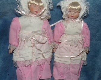 vintage set of 2 twin blonde porcelain doll in historical outfit pink dress with aprons