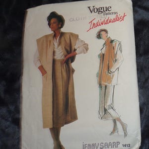 May include: Vogue Patterns Individualist sewing pattern for a long, brown, collared jacket and a skirt. The pattern is by Jenny Sharp and the number is 1412.