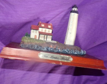 vintage New London Harbor lighthouse figurine on wooden base