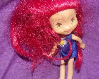 vintage Strawberry Shortcake vinyl doll in blue romper no shoes