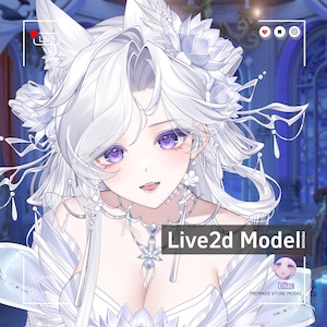 May include: A digital illustration of a character with long white hair, pointed ears, and purple eyes, wearing a white floral headpiece and a detailed necklace. The image includes text overlays reading Live2d Model, Lilac, and Premade Vtube Model.