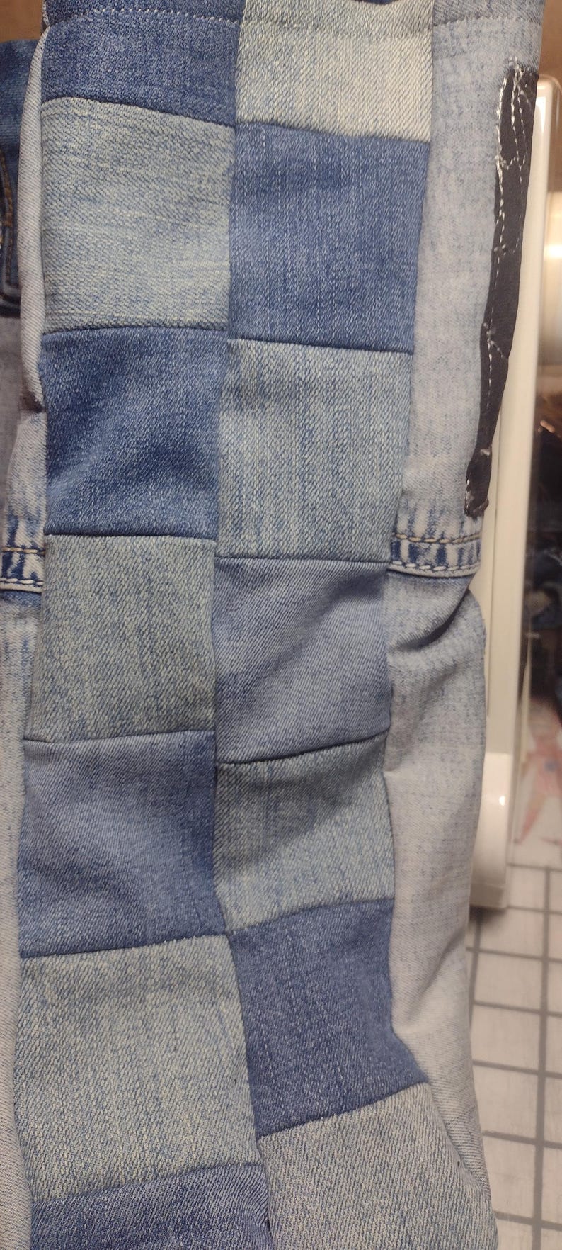 Checker pattern on sides and bottom of tote.