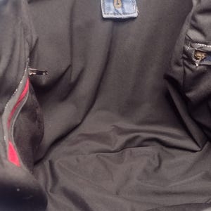 Two zipper pockets on inside of tote.