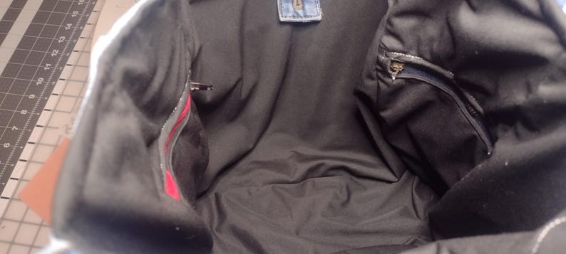 Two zipper pockets on inside of tote.