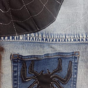 Custom spider and web on front and back of tote.