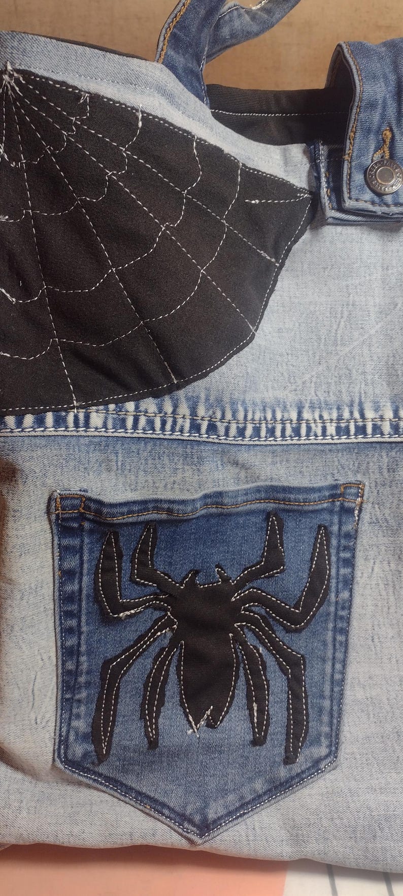 Custom spider and web on front and back of tote.