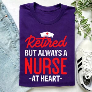 Retired But Always a Nurse at Heart Shirt – Nursing Retirement Gift, Proud RN LPN CNA Nurse Life Tee with Hat Graphic, Purple Nurse T-Shirt