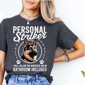 German Shepherd Personal Stalker Shirt – Funny Dog Lover Tee – Bathroom Included Pet Humor Gift – Loyal Pup Graphic Top for Women