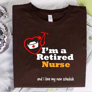 I’m a Retired Nurse and I Love My New Schedule Shirt – Funny Nurse Retirement Gift, Brown T-Shirt with Heart and Hat Design, RN LPN CNA Tee