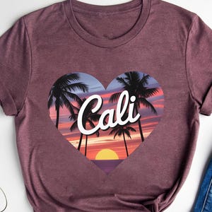 Cali Sunset Shirt – California Heart Palm Tree Tee – Retro Cali Beach Shirt – Summer Coastal Graphic Tee – West Coast Vacation Top