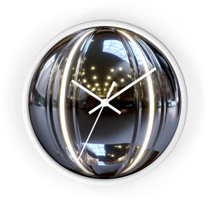 May include: A white framed clock with a reflective, silver, spherical face. The clock face has a series of concentric circles and a white clock hand.