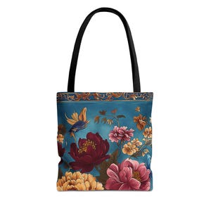 Può includere: Una borsa tote con manico nero e un vivace design floreale. La borsa presenta uno sfondo verde acqua con illustrazioni di fiori nei toni del rosso, rosa e giallo, insieme a un uccello blu e giallo. La parte superiore della borsa ha un bordo decorativo.