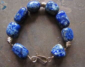 Semi-Precious Large Beads Bracelet. Lapis lazuli and bronze metal beaded bracelet. Elegant blue and golden bracelet. Bold and beautiful.