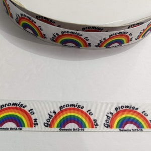 May include: White ribbon with a repeating pattern of a rainbow and the text "God's promise to us. Genesis 9:13-16" in black. The rainbow features red, orange, yellow, green, blue, and purple colors.