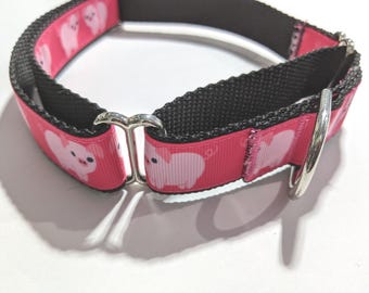 May include: A pink dog collar featuring a repeating pattern of small white cartoon pigs. The collar is constructed from a durable black nylon webbing base with a pink ribbon overlay, secured by silver-toned metal hardware including a D-ring.