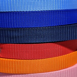 May include: A stack of 14 different colored webbing straps. The straps are made of a woven nylon material and are available in a variety of colors, including black, green, gray, blue, red, orange, pink, brown, purple, and yellow.