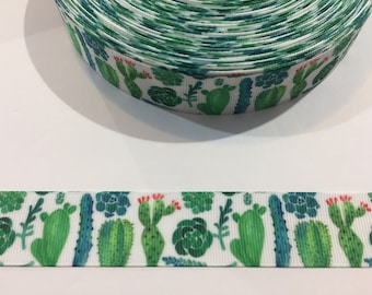 May include: White ribbon with a green and red cactus and succulent print.