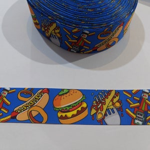 May include: Blue ribbon with a repeating pattern of hot dogs, hamburgers, french fries, and ketchup bottles. The ribbon is 1 inch wide.