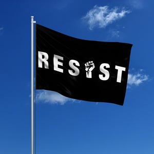 May include: A black flag with the word "RESIST" in white letters and a raised fist symbol in the center.