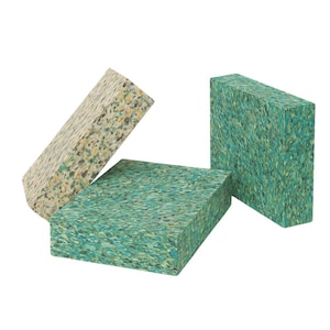 May include: Three rectangular blocks of foam insulation. One block is beige with brown flecks, and the other two blocks are green with blue and white flecks.
