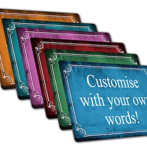 May include: A collection of rectangular signs in shades of brown, teal, purple, red, green, and blue. Each sign features a white decorative border. The front sign displays the text "Customise with your own words!"