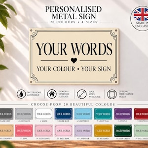 May include: A rectangular metal sign with a cream background and black border featuring the text YOUR WORDS, a heart icon, and the text YOUR COLOUR • YOUR SIGN. Below, a chart displays twenty different colour variations of the same sign.