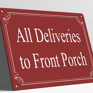 May include: A rectangular maroon metal sign with rounded corners and four small mounting holes. The sign features a white border with decorative corner flourishes and the white text All Deliveries to Front Porch centered on the face.