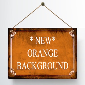 May include: A rectangular wooden sign with an orange background and the words "NEW ORANGE BACKGROUND" in white. The sign is framed with a decorative white border and is suspended by a brown rope.