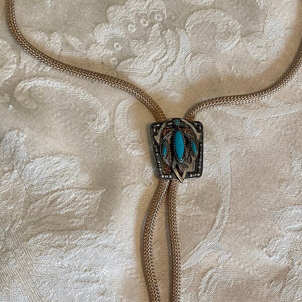 Vintage bolo tie, pewter slide with turquoise stones, tan fabric cording, southwest look