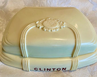 Vintage celluloid display case for a vintage Clinton watch, ivory color with maroon lining