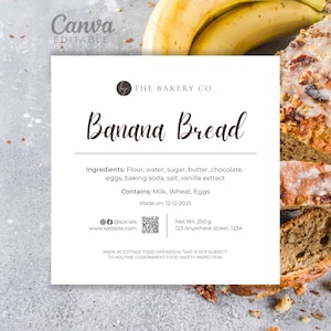 May include: A white label for "Banana Bread" from The Bakery Co. lists ingredients and allergen information. The label is next to a loaf of banana bread and bananas. The bread is sliced, showing a moist interior.