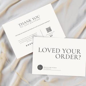 May include: Two white cards with black text on a cream-colored background. One card reads "THANK YOU for your purchase" and the other says "LOVED YOUR ORDER?". The cards have a minimalist design with a QR code and social media icons.