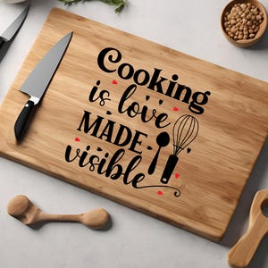 May include: A wooden cutting board with the text "Cooking is love made visible" and a whisk and spoon illustration.