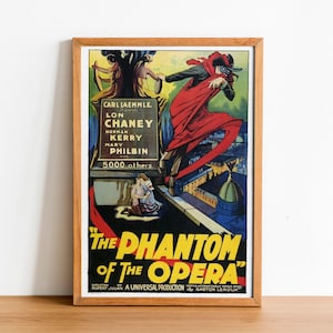 May include: A vintage movie poster for "The Phantom of the Opera" featuring Lon Chaney in a red cape and mask. The poster has a black background with yellow text and a scene of the Phantom running across a rooftop.