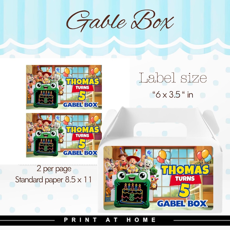 May include: A white gable box featuring a label with the text Thomas Turns 5 Gabel Box, a green frog-shaped cake with five candles, and cartoon characters. The label size is 6 x 3.5 inches, with two labels per 8.5 x 11 inch standard paper sheet.