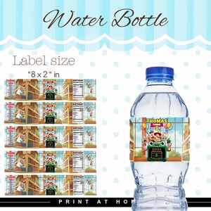 May include: A clear plastic water bottle with a blue cap and a custom label featuring Toy Story characters, the text "Thomas Turns 5," and a birthday cake graphic. The label measures 8 x 2 inches and is shown in a sheet of five identical designs.