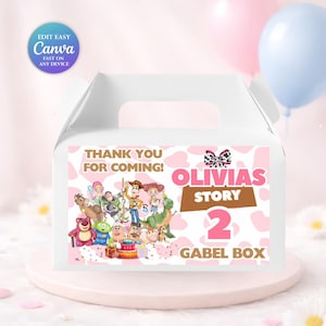 May include: White gable box with a pink and white cow print design. The box features a colorful illustration of cartoon characters and text that reads "THANK YOU FOR COMING! OLIVIAS STORY 2 GABEL BOX".