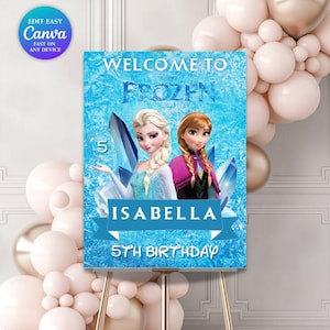 May include: A blue welcome sign for a 5th birthday party, with the text "Welcome to Frozen" and the name "Isabella." The sign features illustrations of Elsa and Anna, with a backdrop of ice crystals. The sign is on a gold easel.