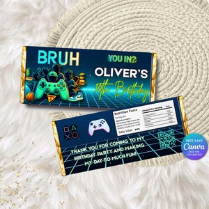 May include: A custom candy bar wrapper with a gaming theme. The wrapper features the text "BRUH" and "YOU IN?" along with "OLIVER'S 10th Birthday". The design includes a controller, pizza, and a basketball. The wrapper also includes a nutrition facts label.