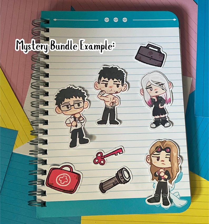 May include: A spiral-bound notebook with a teal cover and lined paper. Several cartoon stickers are placed on the notebook, including characters and objects like a briefcase, key, and first aid kit. The text "Mystery Bundle Example:" is written on the top left.
