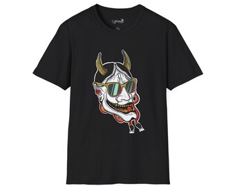 May include: Black t-shirt featuring a graphic of a white, horned demon wearing sunglasses. The demon has gold horns, a red and orange design around the face, and a wide grin. The t-shirt is a short-sleeved crew neck.