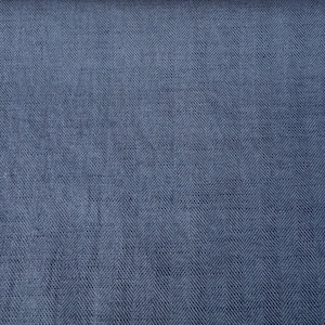 May include: A close-up of a blue herringbone fabric. The fabric has a subtle texture and a slightly faded appearance.