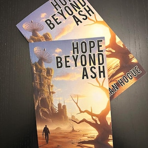 May include: Two copies of the book "Hope Beyond Ash" by Jonathan Hogue. The book cover features a silhouetted figure walking towards a futuristic structure with a satellite dish, under a sunset sky. The title is in large, bold letters.