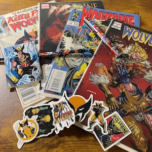 May include: A collection of comic books featuring the Marvel Comics character Wolverine. The comics are in various colors and feature different covers. There are also several stickers with the Wolverine logo and character.