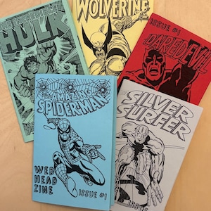 May include: A collection of comic book zines featuring iconic Marvel characters like Spider-Man, Wolverine, and Hulk. Each zine has a unique color scheme and stylized illustrations, with titles such as "Amazing Spider-Man" and "Daredevil".