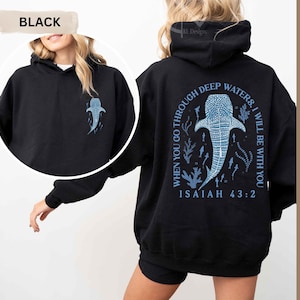 May include: Black hoodie with a whale shark graphic on the front and back. The back features the text "When you go through deep waters, I will be with you. Isaiah 43:2" in blue. The hoodie is a comfortable, casual style.