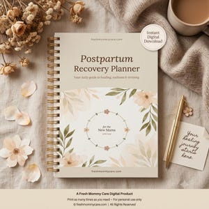 May include: A spiral-bound Postpartum Recovery Planner with a beige cover featuring floral illustrations, the text "Postpartum Recovery Planner", "Your daily guide to healing, wellness & thriving", "for the New Mama", and "freshmommycare.com".